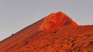 Red volcanic peak at sunset