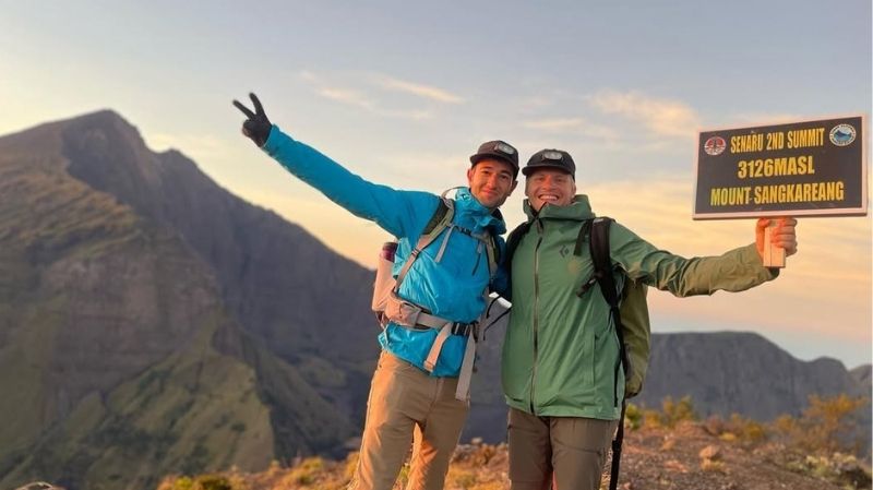 Happy hikers on mountain summit