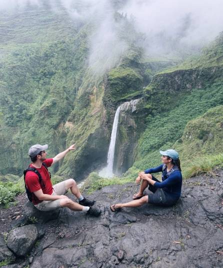 Couple watching waterfall vista